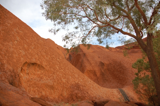 Solen farver Ayers Rock okkerrød