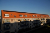 Røde tegltage er pæne, men sorte solceller passer ikke ind.